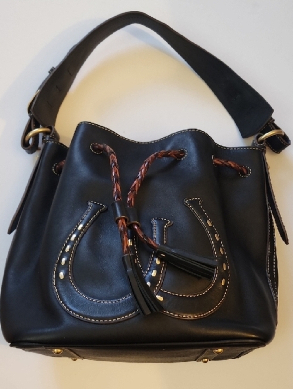 Dooney & Bourke Western Horseshoe Leather Drawstring Bucket Bag.